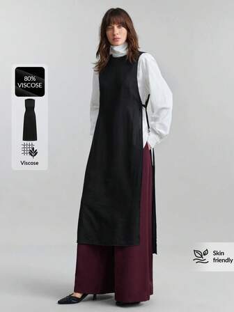 Ontre 2026春夏女装休闲商务复古优雅百搭基础款服装，纳什维尔服饰系列，纯色系带无袖上衣，适合都市通勤、商务休闲、婚礼宾客等场合，黑色两件套长款衬衫，腰部系带