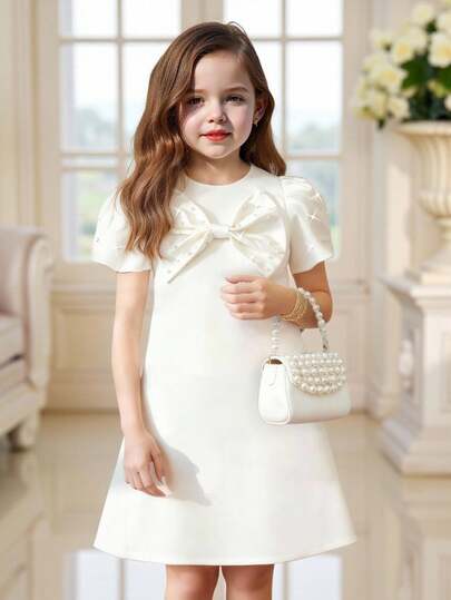 Elladie kids 1件女童夏季新款2025白色缎面A字圆领夸张水滴泡泡袖连衣裙，正面饰有超大蝴蝶结和串珠设计，优雅派对礼服，适合外出、生日、公主等场合。