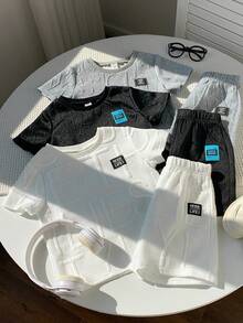 SHEIN 6件套男童纹理面料短袖T恤和短裤套装，每套2件，适合通勤、上学、日常休闲、度假、旅行、运动、儿童服装、学生制服、亲子装、生日派对、春夏季节穿着。 - 彩色 - 查看 8