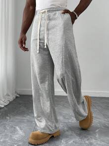 Manfinity Homme 男士宽松休闲开衩弧形裤脚运动裤，适合日常休闲穿着、周末外出、聚会等场合。这款裤子是男士衣橱中不可或缺的百搭单品，也是送给男友或丈夫的绝佳礼物。 - 灰色 - 查看 4