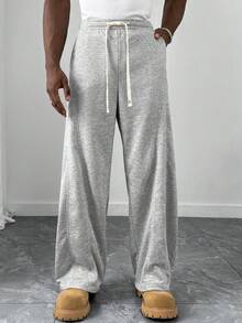 Manfinity Homme 男士宽松休闲开衩弧形裤脚运动裤，适合日常休闲穿着、周末外出、聚会等场合。这款裤子是男士衣橱中不可或缺的百搭单品，也是送给男友或丈夫的绝佳礼物。 - 灰色 - 查看 3