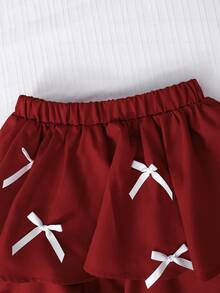 SHEIN Bộ đồ thời trang thanh lịch dành cho bé gái tuổi teen, áo thun trắng phối cùng chân váy đen dệt kim, áo có nơ đen trang trí, chân váy đính ngọc trai. - Màu Đỏ Sâu - Xem 5