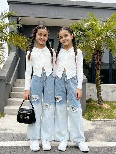 Elladie kids 两件套少女时尚百搭牛仔套装，适合春、夏、秋、冬四季穿着，白色，蝴蝶结装饰V领修身针织长袖上衣搭配复古浅蓝色破洞阔腿牛仔裤，面料柔软舒适，时尚百搭，适合日常出行。