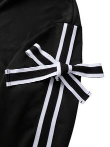 GlowEve CURVE طقم ملابس علوية طويلة الأكمام مزينة بشريط وسروال ضيق أسود طويل مجموعة قطعتين للمرأة ذات الحجم الكبير بتصميم بسيط - الأسود - مشاهدة 5