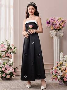 Pitira 这款优雅的缎面拼接无袖褶皱腰连衣裙，适合少女穿着，可用于派对、约会、家庭聚会、正式场合、返校季、校园风、通勤、购物、婚礼、生日派对、毕业舞会和伴娘活动等场合。裙摆饰有荷叶边，并采用高开衩设计，也可作为婚礼宾客、毕业典礼和宴会的正式晚礼服。 - 黑與白 - 查看 5