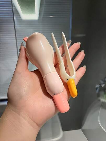 Zazumi Accesorio de baño esencial para la limpieza del hogar: Cubierta de drenaje atrapapelo en forma de pato amarillo de dibujos animados, herramienta quitapelo reutilizable para ducha, fregadero, bañera y cocina, con clips y pegatinas