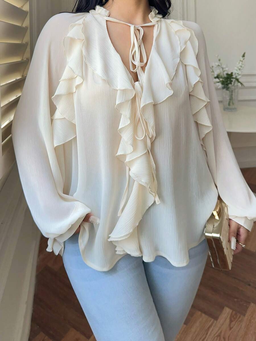 Vibekara Áo kiểu tay dài cổ chữ V sâu, chất liệu chiffon dày dặn, có bèo nhún, tay buộc dây, dành cho người có vóc dáng lớn. - Màu be - Xem 1