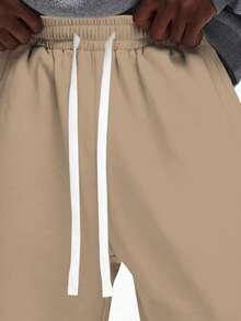 Quần jogger dáng rộng SUMWON với dây rút ở eo và bo chun ở ống quần, chất liệu cotton thoải mái, kiểu dáng trơn. - Lạc đà - Xem 2
