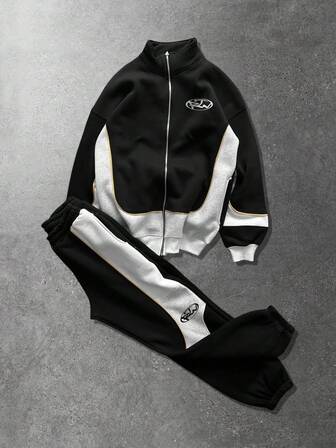 Ensemble décontracté pour homme composé d'un sweat-shirt à capuche à col montant avec imprimé lettres et fermeture éclair, et d'un pantalon de survêtement avec cordon de serrage à la taille. Idéal pour les vacances, les trajets et les voyages.