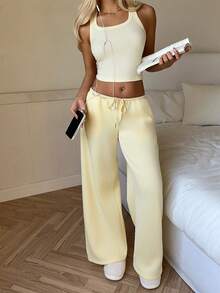 CovetEZ Bộ 2 món áo croptop không tay và quần dài cho nữ, màu vàng nhạt, vàng bơ, bộ hai mảnh thoải mái, bộ hai mảnh màu kem, bộ hai mảnh mùa hè, bộ hai mảnh thường ngày thoải mái cho nữ, bộ trang phục hai mảnh thường ngày cho nữ, trang phục mùa hè hai mảnh cho nữ, bộ đồ hai mảnh mùa hè cho nữ. - Màu vàng ngỗng - Xem 3