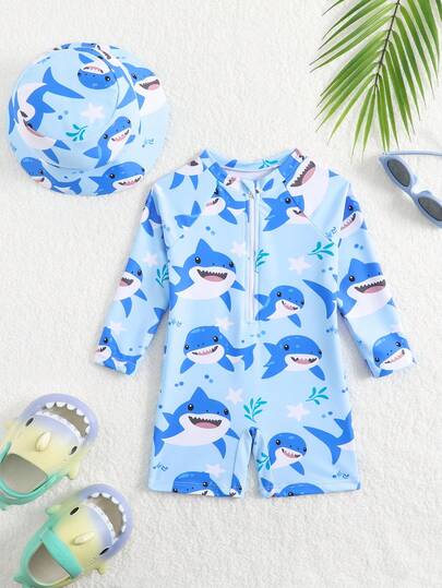 SHEIN Traje de baño para niños pequeños, bañador de una pieza con estampado de dinosaurios lindos y manga larga, con gorro de sol, adecuado para vacaciones de verano, playa, surf, parque acuático