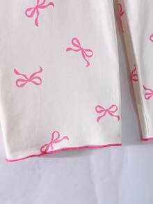 少女睡衣套装，上衣带有领子和蝴蝶结装饰，搭配休闲裤，采用舒适的牛奶丝面料，印有蝴蝶图案，可爱又优雅。 - 杏色 - 查看 6