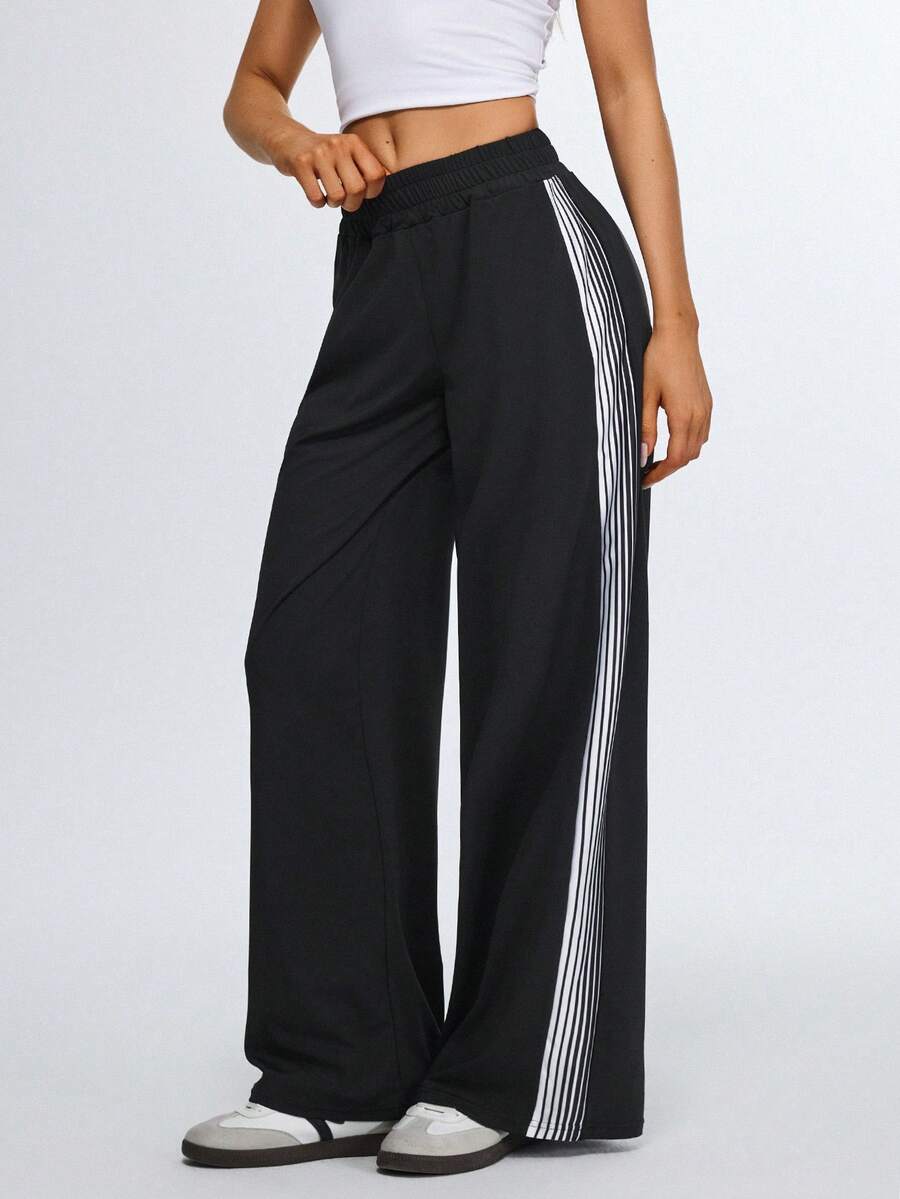 Eassivo Eassivo Calça esportiva feminina de corte reto com detalhes em fita lateral, ideal para academia, treinos, atividades ao ar livre e deslocamentos diários. - Preto - Ver 1