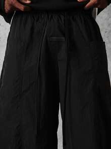SUMWON Quần ống rộng dáng suông bằng nylon có dây rút và túi bên hông, phong cách đường phố thường ngày, thoải mái cho mùa đông và mùa xuân. - màu đen - Xem 8