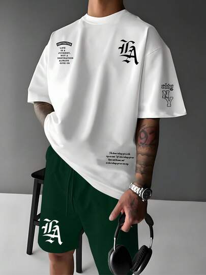 Manfinity LEGND Men's Casual Slogan Graphic Round Neck Short Sleeve T-Shirt And Shorts Set, Summer