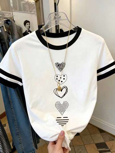 Resyla Camiseta de mujer con cuello redondo, estampado de corazón a rayas de color block, para uso casual diario