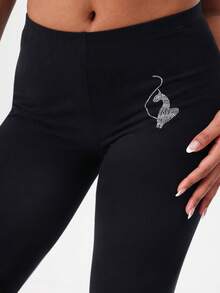 BABYPHAT 印花高腰七分紧身裤，饰有品牌标志和粉色点缀，舒适的七分运动裤，适合日常休闲穿着。 - 黑色 - 查看 7