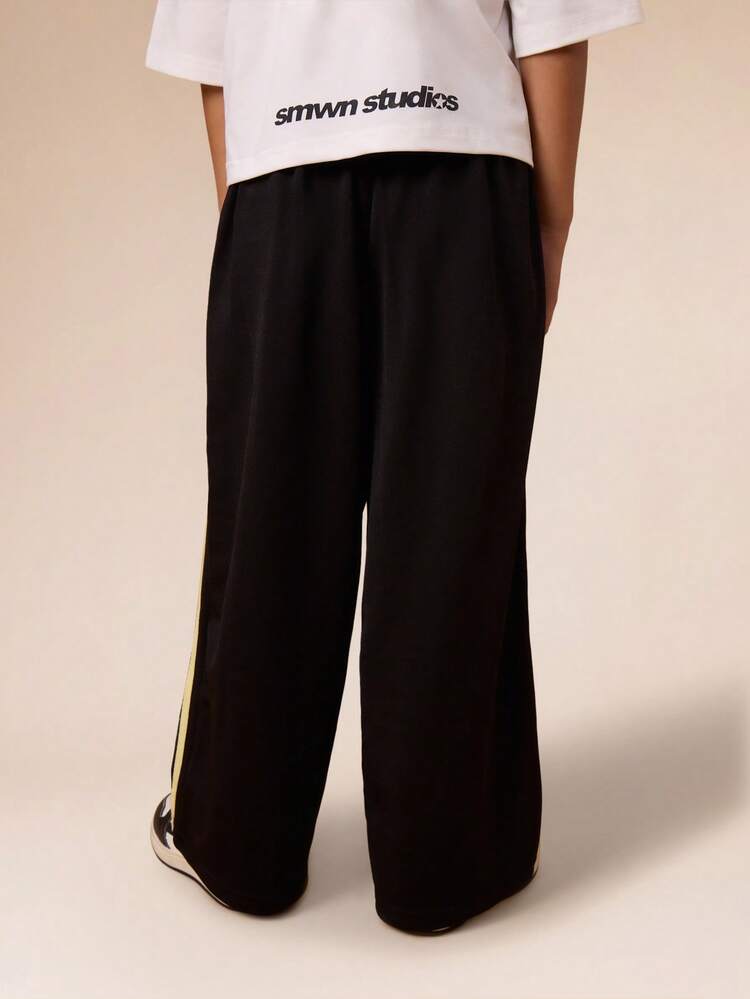 Calças de treino com faixa lateral