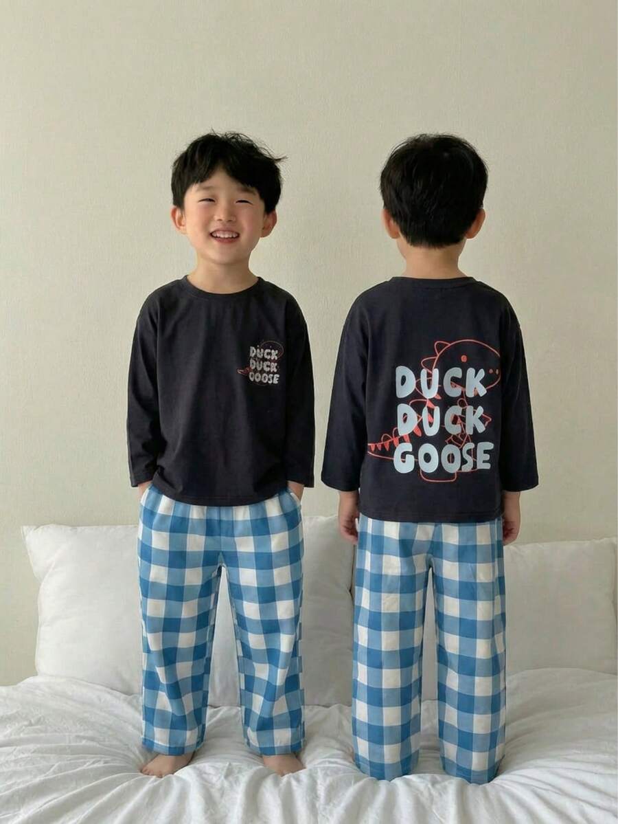 2pcs Toddler Boys Casual Dinosaur & Letter Print Round Neck Long Sleeve Top And Plaid Loose Pants Homewear Set Boys 2 Pcs Set Boys Sleep Wear Boys Pajama Boys Lounge Set Youth Boy Pajamas Young Boys Pajamas-2 Piece Pajama Set Duck Dinosaur Graphic Navy Round Neck Long Sleeve Top Blue White Checkered Pants Lightweight Stretchy Sleepwear Set Cozy Bedtime Loungewear Holiday Gift 2026 New Year Essential All Season Casual Playful - Black - View 1