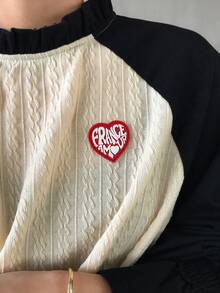 FRIFUL Camiseta holgada de manga larga con cuello de tortuga medio, mangas raglán de color contrastante, volantes y etiqueta de punto con corazón, estilo casual de calle para mujer - Negro - Ver 4