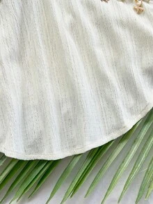 Soleia Áo kiểu nữ dáng rộng, cổ yếm, hở lưng, thắt nơ, phối hoa, bèo nhún, thích hợp cho đi biển, dự tiệc, lễ tốt nghiệp. - Màu be - Xem 4