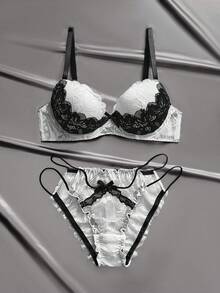 粉色和黑色蕾丝内衣套装，镂空钩编设计，性感细肩带，亲肤贴身