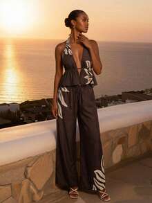 CAJUNI Bộ đồ gồm áo không tay cổ chữ V sâu, thắt eo, in họa tiết lá cây và quần ống rộng thời trang. - màu nâu - Xem 3