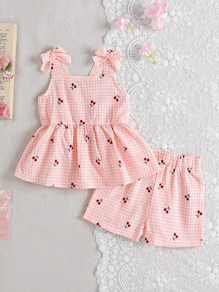 SHEIN Bộ 2 món cho bé gái: Áo hai dây in hình quả anh đào và nơ, không tay kẻ sọc + quần đùi cạp chun, trang phục thường ngày dễ thương, phù hợp cho mùa hè đi chơi hoặc du lịch. - Hồng - Xem 1