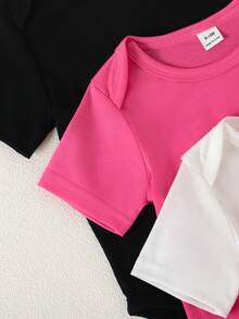 SHEIN Playful Pals Bộ 5 món áo liền thân cổ tròn màu trơn mềm mại và thoải mái cho bé gái, kiểu dáng thời trang thường ngày, dễ mặc vào/cởi ra, tay ngắn và quần short, thích hợp cho mùa xuân/hè. - Nhiều màu - Xem 5