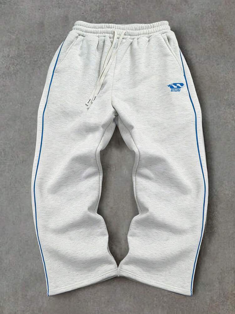 Pantalones deportivos con raya lateral azul