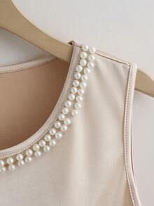 GlowEve 女士珍珠装饰无袖露脐上衣和高腰A字中长裙套装，闪亮面料，优雅精致，适合工作、约会、晚餐、外出等场合，春夏皆宜。 - 杏色 - 查看 7