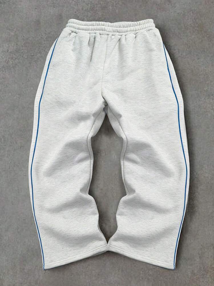 Pantalones deportivos con raya lateral azul