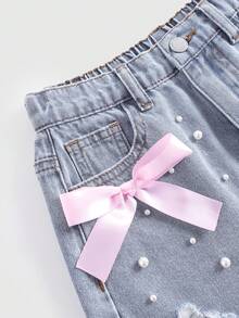 SHEIN Girlism 少女时尚休闲 Y2K 复古酷炫街头优雅浅色水洗做旧蝴蝶结牛仔短裤，带口袋插片、仿珍珠和毛边裤脚，是日常穿着、春夏锐舞派对和街头潮流的理想之选。SS26 新款时尚 - 藍色 - 查看 3