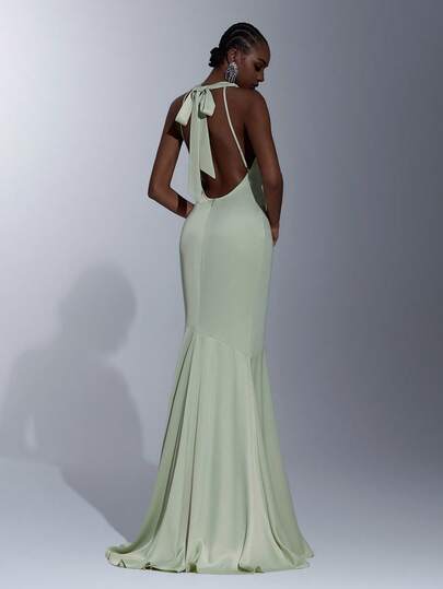 Elitara Elegant, Simple, And Stylish Dark Green Luxurious Satin Dress With Handmade Bow Embellishments, Halter Neck, And A Sexy Open Back Mermaid Silhouette With A Short Train. Suitable For All Formal Occasions, Wedding Guests, Bridesmaid Dresses.