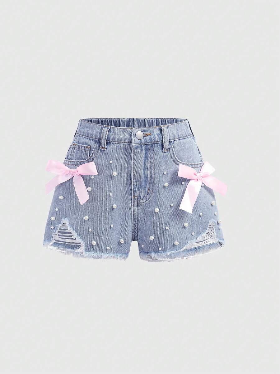 SHEIN Girlism 少女时尚休闲 Y2K 复古酷炫街头优雅浅色水洗做旧蝴蝶结牛仔短裤，带口袋插片、仿珍珠和毛边裤脚，是日常穿着、春夏锐舞派对和街头潮流的理想之选。SS26 新款时尚 - 藍色 - 查看 1