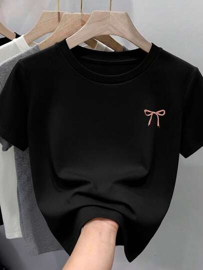 Camiseta para mujer de 100% algodón, suave y cómoda de manga corta y cuello redondo con estampado de moñito moño pequeño de listón rosa