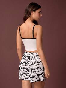 Kung Fu Panda X SHEIN Bộ đồ ngủ nữ in hình gấu trúc, áo croptop không tay và quần short, thích hợp cho mùa hè. - Đen và trắng - Xem 2