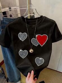 Resyla تي شيرت نسائي كاجوال بأكمام قصيرة وياقة مستديرة مزين بطباعة قلب ورينستون، هدية للأصدقاء - الأسود - مشاهدة 4