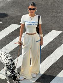 Muchica Bộ đồ nữ thường ngày gồm áo thun crop top in khẩu hiệu và quần dài. - Màu be - Xem 5