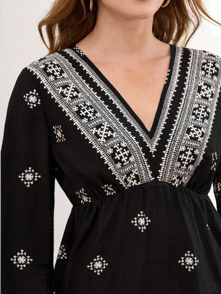 This Elegant Women's Blouse Features A Classic Black And White Color Block Design, Perfectly Matching The Sophisticated Atmosphere Of The New Year. The Geometric Embroidered Pattern Adds A Touch Of Retro Style With A Modern Twist. The V-Neck, Lantern Sleeves, And Fitted Waist With A Flared Hem Create A Relaxed Yet Dynamic Silhouette, While The Embroidered Details Add A Touch Of Luxury. Suitable For Spring And Autumn, It Can Be Paired With Black Trousers For A Sharp Look Or Layered With A Jacket For Added Depth. Perfect For Casual Gatherings Or Everyday Outings, This Blouse Showcases Unique Taste With Its Resort-Inspired Print And Fashionable Style With Its Contrasting Colors. It's A Versatile Piece That Combines Personalized And Quality For Your New Year's Wardrobe.