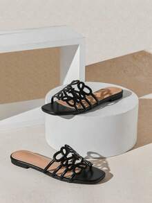 SHUZIA Women's Elegant Floral Cut-Out Slip-On Flat Sandals - Black - View 1