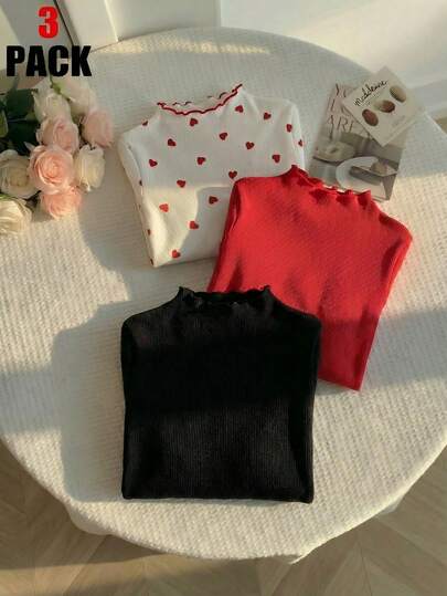 SHEIN Sparklyn 三件不同颜色的修身长袖T恤，适合女孩穿着，款式有三种：纯黑色、红色和红色心形图案。这三件套适合春秋季休闲穿着，也可作为这两个季节的基础内搭。