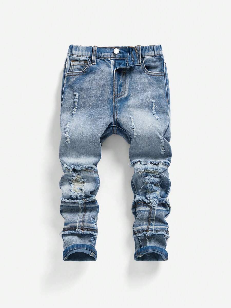 SHEIN 男童时尚街头酷炫破洞拼接毛边浅灰色修身牛仔裤，带有做旧细节，适合秋冬户外穿着。 - 中等水洗藍 - 查看 1