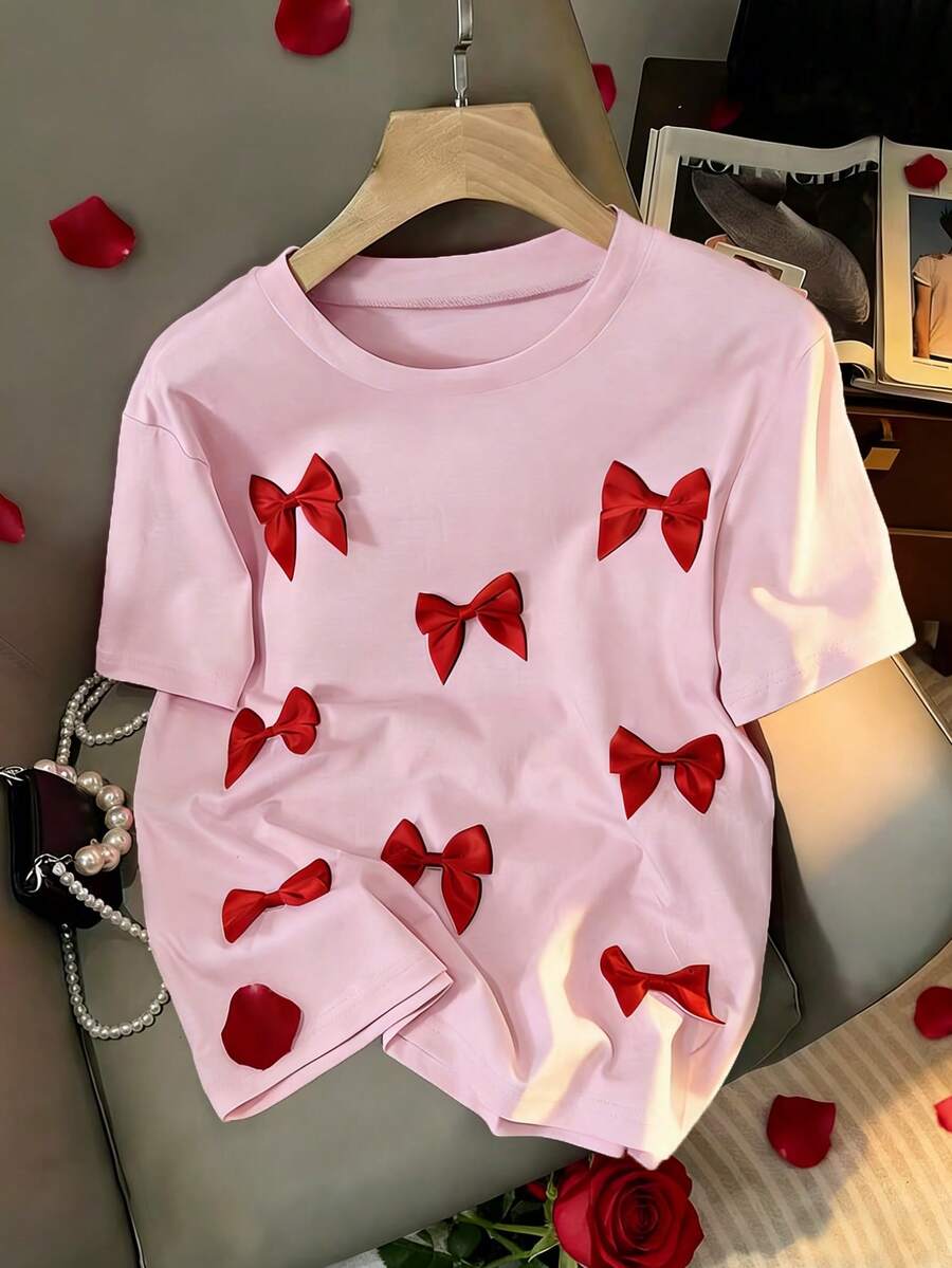 Resyla Chic Women's Baby Pink Short Sleeve Tee With Eye-Catching Bow Front Details Regular Length Knitted Round Neck - Baby Pink - View 1