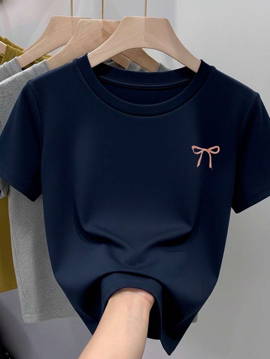 Camiseta para mujer de 100% algodón, suave y cómoda de manga corta y cuello redondo con estampado de moñito moño pequeño de listón rosa - Azul Marino - Ver 1