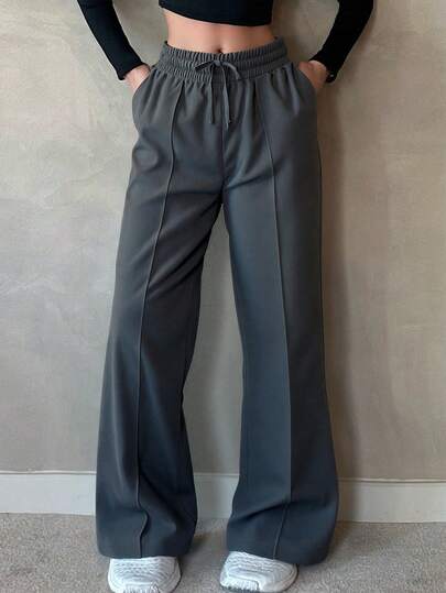 Pantalones de Pierna Ancha con Cintura Elástica y Cordón: Comodidad Ajustable y Estilo Elegante para Tu Guardarropa