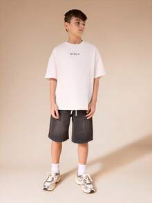 SUMWON Pantalones cortos de mezclilla lavados con ajuste relajado, costuras de contraste y bolsillos laterales para niños, bermudas casuales de longitud hasta la rodilla para vacaciones de verano - Negro - Ver 3