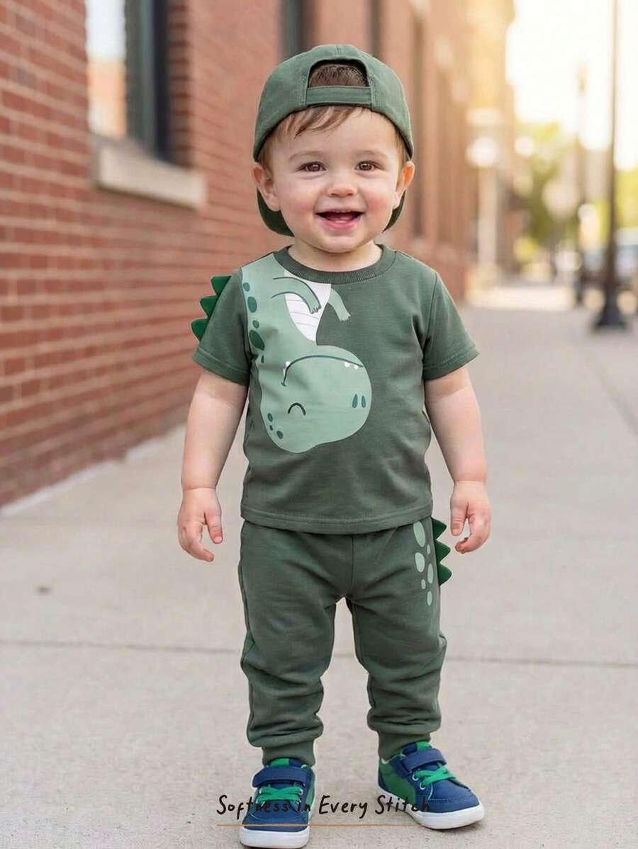 Cozy Pixies Conjunto de 2 piezas de top de manga corta de cuello redondo suave con estampado de dinosaurio de dibujos animados y pantalones de cintura elástica para bebé niño - Verde - Ver 1