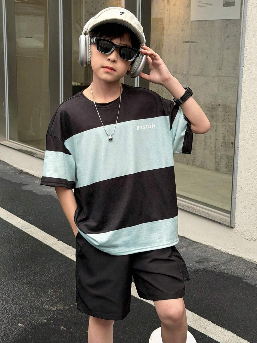 SHEIN 2件套男童时尚休闲百搭舒适两件套：撞色拼接圆领T恤和宽松工装短裤，适合春夏日常穿着、运动、郊游、上学、聚会、节日、拍照等场合。