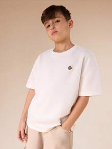 SUMWON Boys Oversized Crew Neck Short Sleeve Badge Logo Detail T-Shirt Casual Summer Top - White - View 1